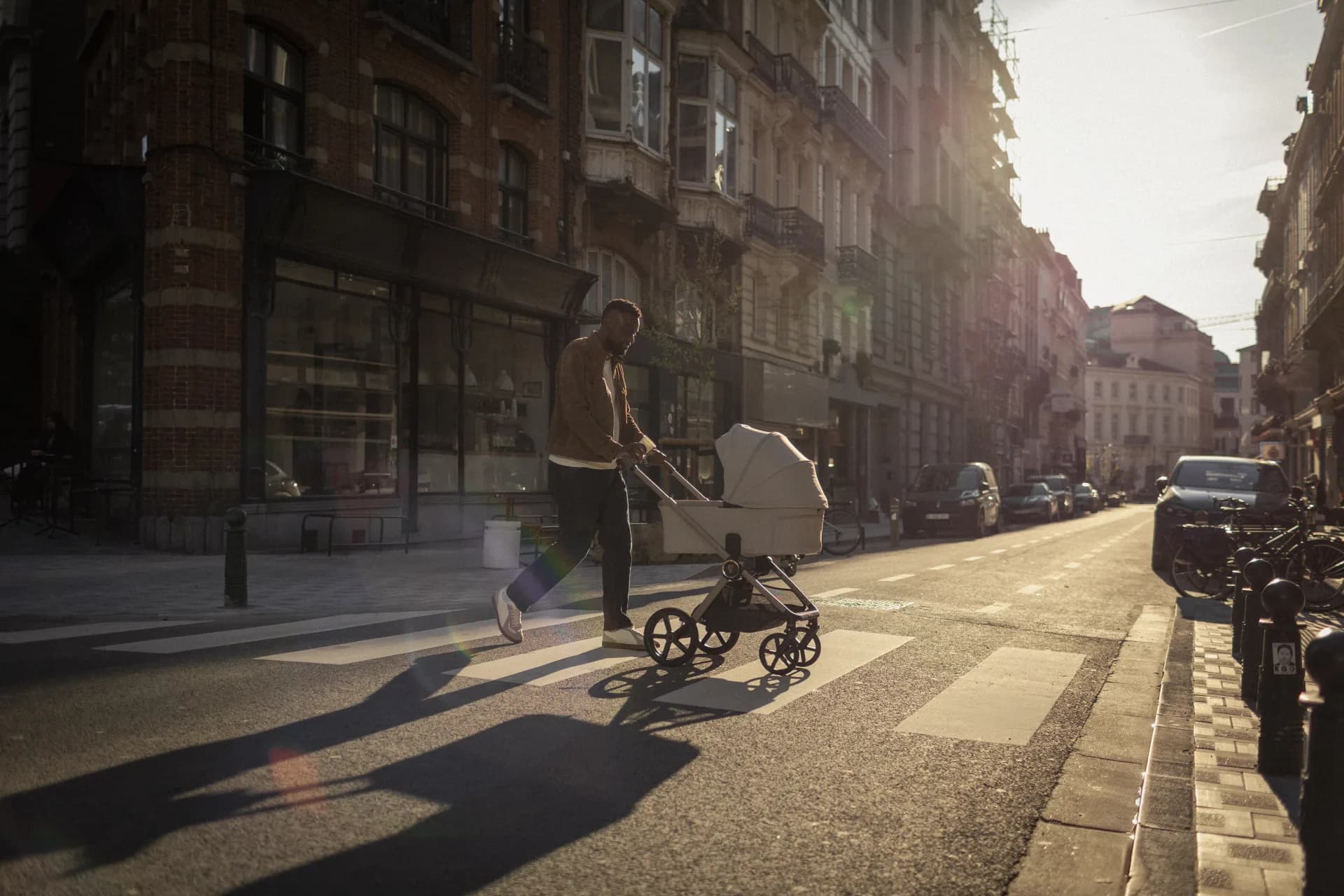 A parent walking with a Venicci Upline 3 pushchair